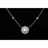 A CULTURED MABE PEARL AND DIAMOND PENDANT NECKLACE