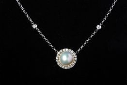 A CULTURED MABE PEARL AND DIAMOND PENDANT NECKLACE