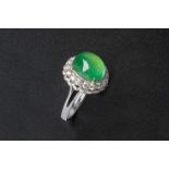 AN ICY GREEN JADEITE AND DIAMOND RING