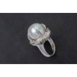 A CULTURED PEARL AND DIAMOND RING