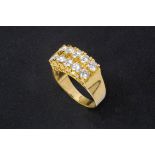 A GOLD AND DIAMOND RING