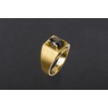 A BLACK STONE AND GOLD RING