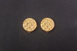 A PAIR OF GOLD BUTTON COVERS BY STELLA