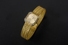 A PIAGET LADIES GOLD AND DIAMOND BRACELET WATCH