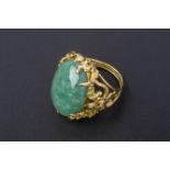 A LARGE JADE CABOCHON RING