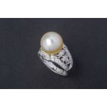 A CULTURED PEARL AND DIAMOND RING