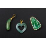 A GROUP OF THREE JADE PENDANTS