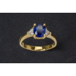 A SAPPHIRE AND DIAMOND RING
