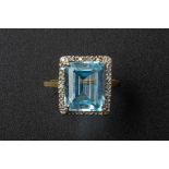 A TOPAZ AND DIAMOND RING