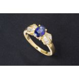 A SAPPHIRE AND DIAMOND RING