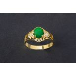 A CABOCHON JADE AND DIAMOND RING