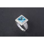 A BLUE TOPAZ AND DIAMOND RING