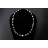 A TAHITIAN CULTURED PEARL NECKLACE AND EARRING SET