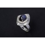 A STAR SAPPHIRE AND DIAMOND CLUSTER RING