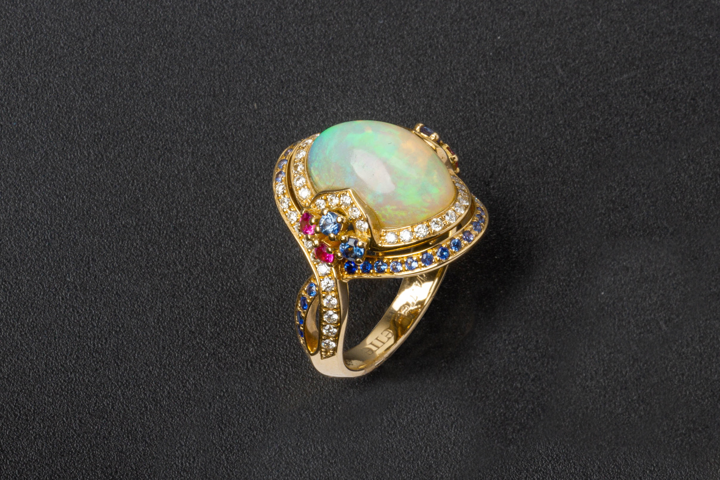 AN OPAL, SAPPHIRE AND DIAMOND RING