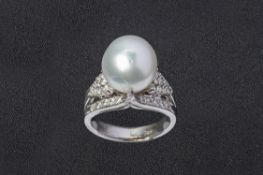 A CULTURED PEARL AND DIAMOND RING