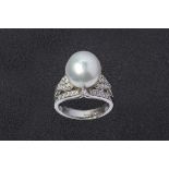 A CULTURED PEARL AND DIAMOND RING