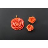 A CARVED CORAL PENDANT AND EARRING SET