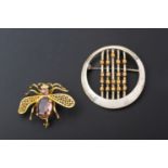 A MODERNIST SILVER BROOCH AND A GILT METAL BEE BROOCH