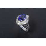 A TANZANITE AND DIAMOND CLUSTER RING