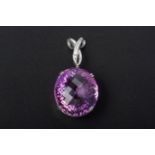 AN AMETHYST AND DIAMOND PENDANT