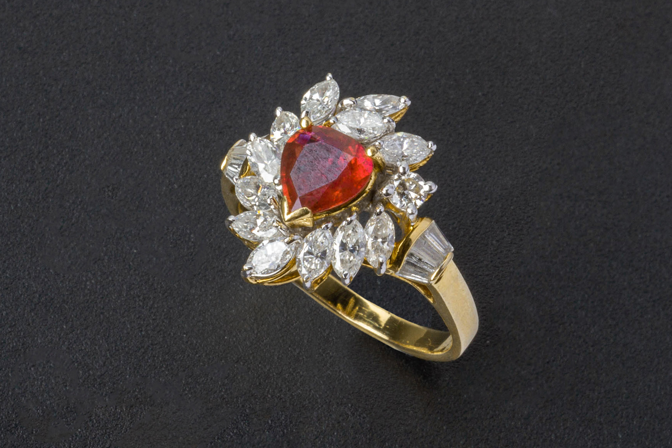 A RUBY AND DIAMOND CLUSTER RING