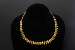 AN INDIAN GOLD NECKLACE