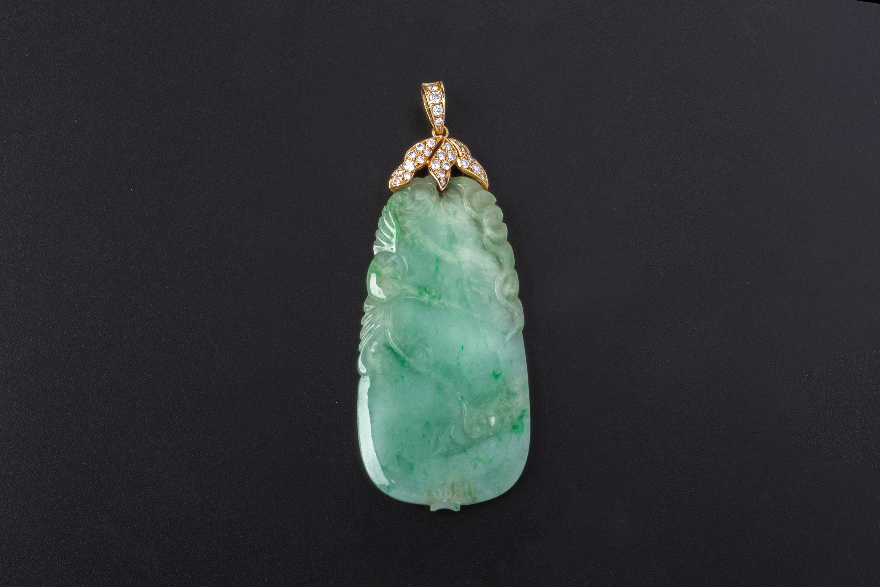 A JADE AND DIAMOND PENDANT