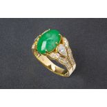 A CABOCHON JADE AND DIAMOND RING