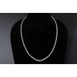 A BEZEL SET DIAMOND NECKLACE