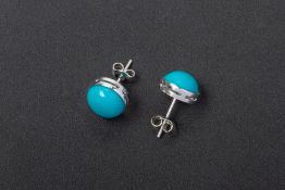 A PAIR OF WHITE GOLD AND TURQUOISE CABOCHON STUD EARRINGS