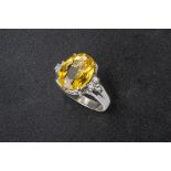 A YELLOW BERYL AND DIAMOND RING