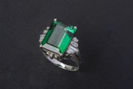 A GREEN TOURMALINE AND DIAMOND RING