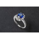 A SAPPHIRE AND DIAMOND RING