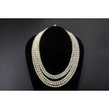 A FIVE STRAND CULTURED PEARL NECKLACE