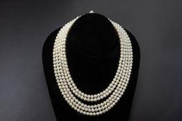 A FIVE STRAND CULTURED PEARL NECKLACE