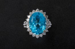 A BLUE TOPAZ AND DIAMOND CLUSTER RING