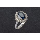 A SAPPHIRE AND DIAMOND CLUSTER RING