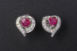 A PAIR OF RUBY AND DIAMOND HEART SHAPED EARRINGS