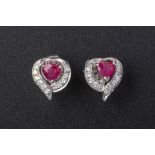 A PAIR OF RUBY AND DIAMOND HEART SHAPED EARRINGS