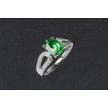 A TSAVORITE AND DIAMOND RING