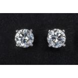 A PAIR OF DIAMOND STUD EARRINGS