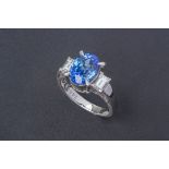 A SAPPHIRE AND DIAMOND RING