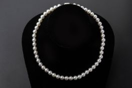 AN AKOYA SINGLE STRAND CULTURED PEARL NECKLACE
