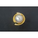 A CULTURED MABE PEARL AND DIAMOND RING
