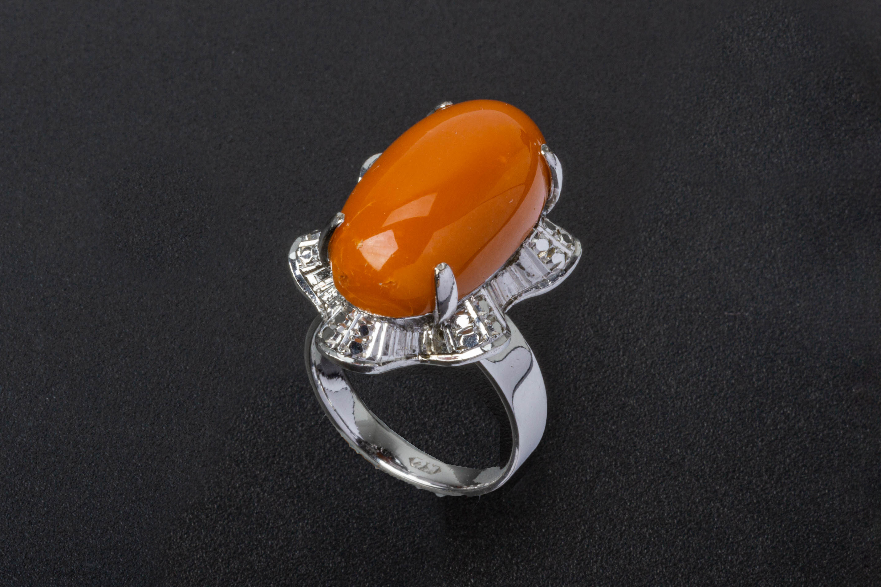 A CORAL SINGLE STONE RING