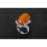 A CORAL SINGLE STONE RING