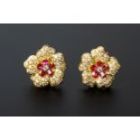 A PAIR OF RUBY AND DIAMOND CLUSTER EARRINGS