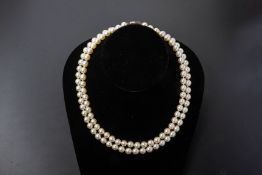 A CULTURED PEARL TWO STRAND NECKLACE BY MIKIMOTO