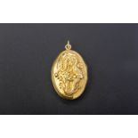 AN 18K GOLD DRAGON LOCKET